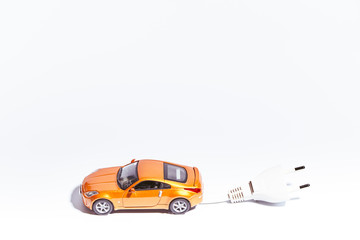 miniature of a vehicle with electric plug on a white background
