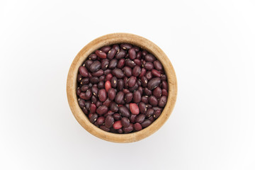 red beans in a wooden plate on a white background