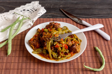 The stewed green beans and pieces of beef