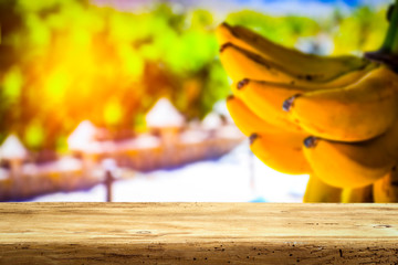 Table background and fresh bananas 