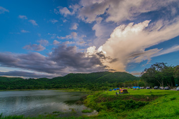 Tent spots along the reservoir in the middle of the forest Resting place pubbic cludy sky rain coming