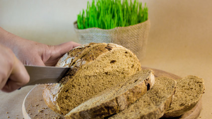 beautiful chunks of rye bread on a wooden board slicing bread close up