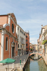 Fototapeta na wymiar Narrow water channel in Venice Italy