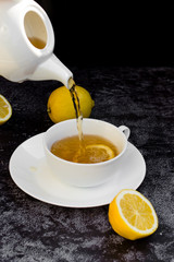 pour tea into a glass cup
