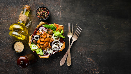 Marinated mushrooms with onions and spices in a plate. on rustic background, top view, banner.