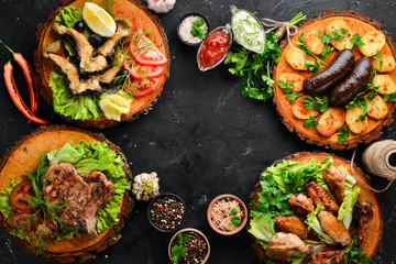 Barbecue. Steak, fish, chicken wings. Top view. Free space for your text.