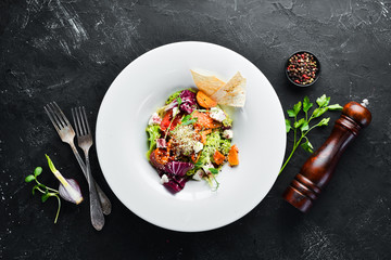 Vegetable salad with cabbage with feta cheese. In the plate. Top view. Free space for your text. Rustic style.