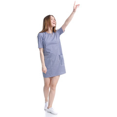 Woman in blue dress showing pointing on white background isolation