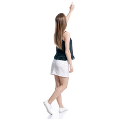 Woman in white skirt and black showing pointing on white background isolation, back view