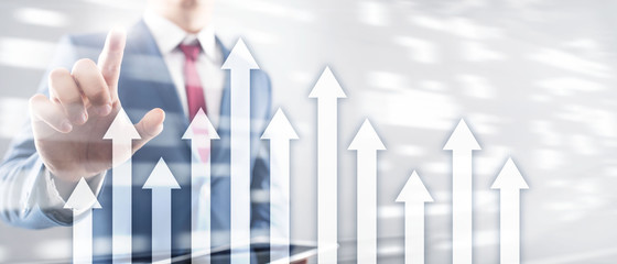Up arrow graph on skyscraper background. Invesment and financial growth concept.