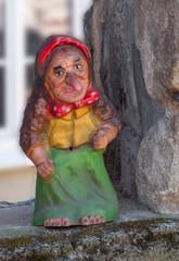 Old kind witch woman statue. No fear. Fairy tale - 259780189