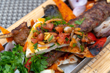 Kebab with vegetables and pita bread - traditional Turkish dish