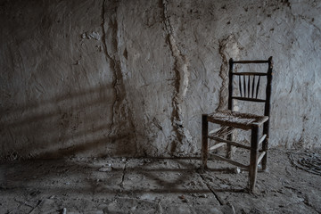 Fototapeta na wymiar old chair on the wall