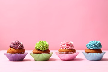  delicious cupcakes on a colored background. Festive background, birthday