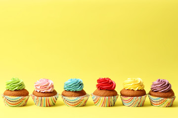  delicious cupcakes on a colored background. Festive background, birthday