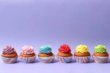 delicious cupcakes on a colored background. Festive background, birthday
