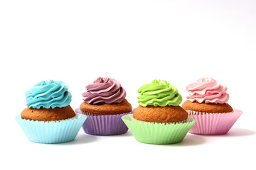  tasty cupcakes on a white background.