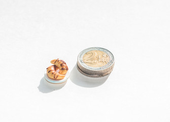 A croissants and money isolated on white