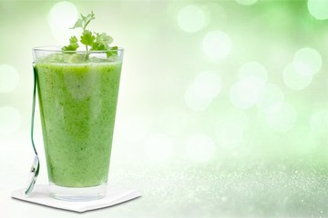 Vegetable smoothie on abstract background
