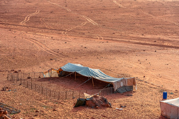 bedouin camp in incredible lunar landscape in Wadi Rum village in the Jordanian red sand desert....