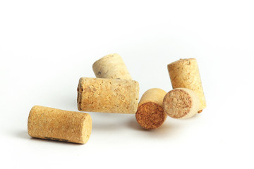 Falling wine bottle caps on a white background