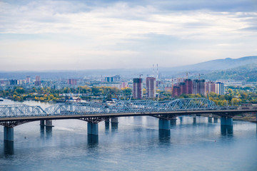 Fototapeta na wymiar the bridge over the Yenisei river, city view
