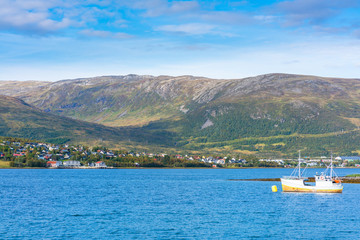 Fototapeta premium View of Eidkjosen on Kvaloya island in Troms county across the fjord, Norway