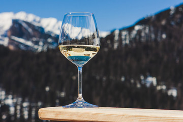 A glass of white sparkling Prosecco wine in a lodge in Cortina d'Ampezzo, Dolomites, Italy