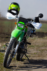 Green motorcycle parked on the road