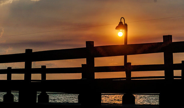 Grand sunset in a small harbor located next to a hotel on the Caribbean coast