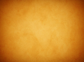 An elegant, rich tan parchment texture background with shadowed corners and glowing center. 