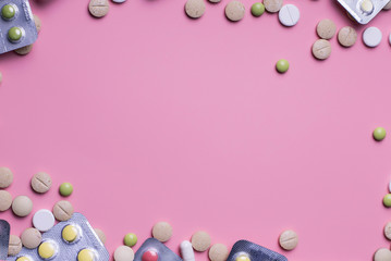 harmaceuticals antibiotics pills medicine /colorful antibacterials pills on pink background /capsule pill medicine. Creative idea. Drugs. Sad. Die. Illness