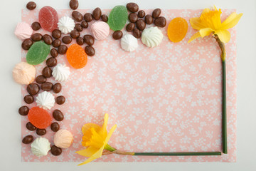 chocolates with peanuts, marshmallows and marmalade on a fabric background