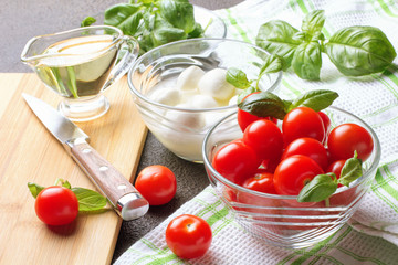 Caprese Salad. Tomatoes, basil, mozzarella and oil.