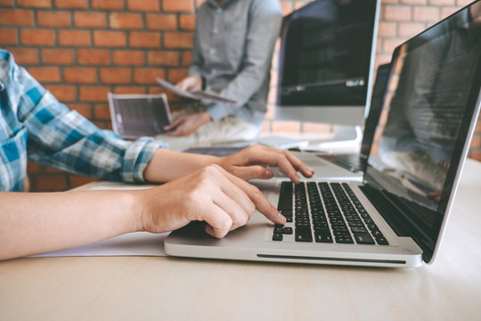 Team of Professional Developer programmer cooperation meeting and brainstorming and programming in website working a software and coding technology, writing codes and database