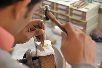 Craftsman working damascene
