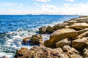 Fototapeta na wymiar Sea stones rocks washed by sea waves-seascape