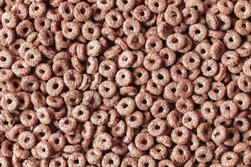 background of corn chocolate flakes. the view from the top. the texture of corn flakes. ready Breakfast close-up.