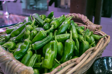 Raw Green Organic Bell Peppers in a basket