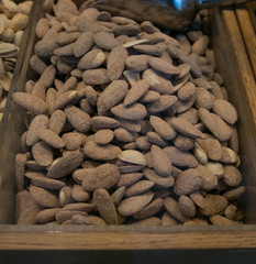 Background of big raw peeled almonds in San Miguel Market Madrid