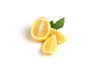 Ripe lemon with green leaves