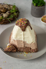 Paskha (Pasha) with three types of chocolate decorated with chocolate glaze. Traditional Russian...
