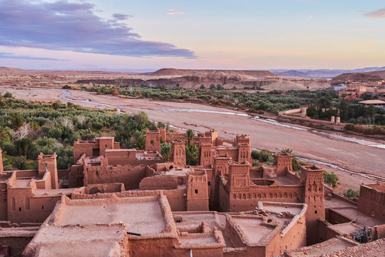 Ancient city near river in desert and wonderful sky