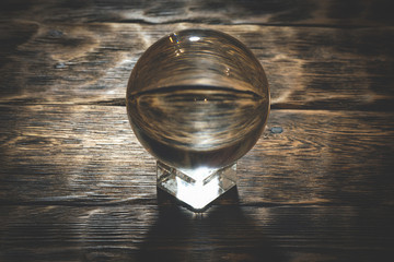 Crystal ball on the magic table background. Future reading.
