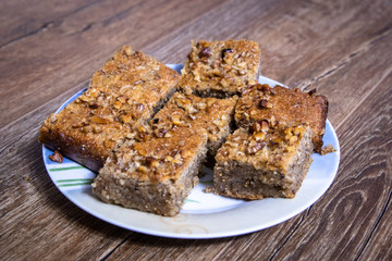 Homemade cookies with walnuts on vintage wooden table