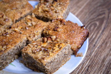 Homemade cookies with walnuts on vintage wooden table