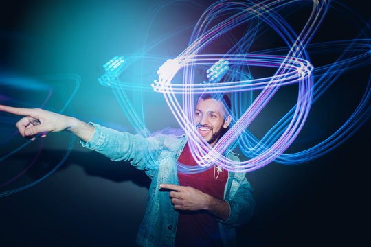Handsome bearded man dancing in spotlight
