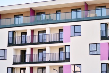 European modern residential architecture. Fragment of a modern apartment building in front. Very modern apartment house. 