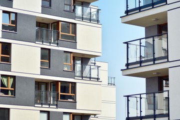 European modern residential architecture. Fragment of a modern apartment building in front. Very modern apartment house. 