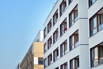 European modern residential architecture. Fragment of a modern apartment building in front. Very modern apartment house. 